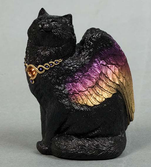 A jet-black cat with iridescent wings wearing a gold colar with a topaz gem