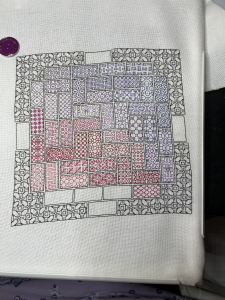 Multicolored needlework on a white background